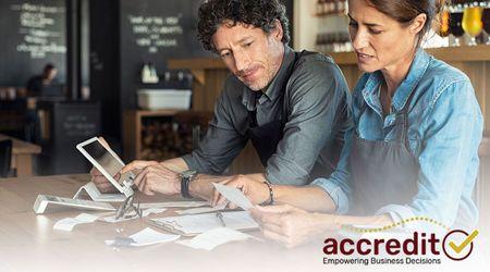 Two people looking at receipts.