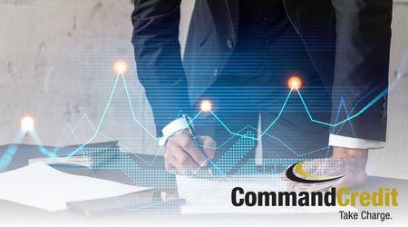 An man standing at a desk, examining a report. There's an overlay of a line chart. The Command Credit logo is in the bottom right corner.