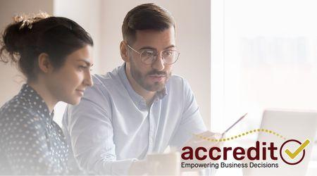 Two people looking at a report.