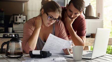 Two people looking at a report.