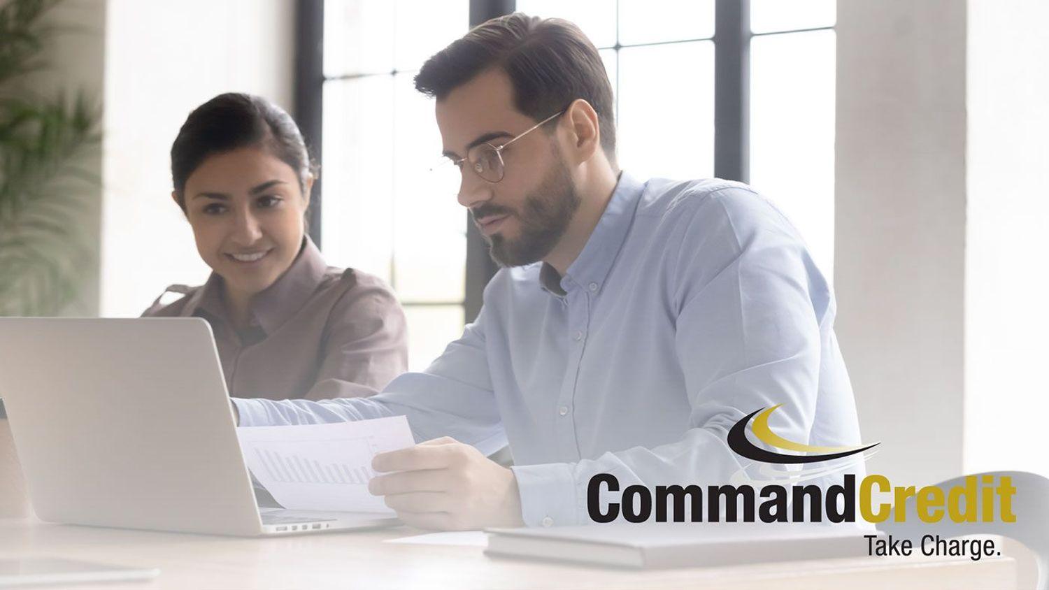 Two people looking at a report.