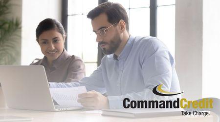 Two people looking at a report.