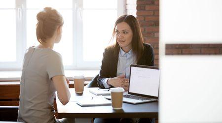 Two woman talking.