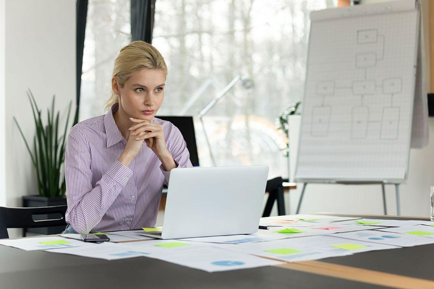 Woman working on laptop.