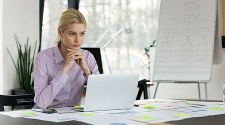 Woman working on laptop.