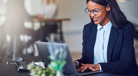 Woman working on laptop.