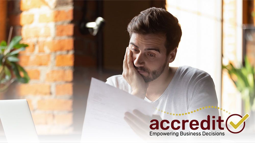 Man looking at a report.
